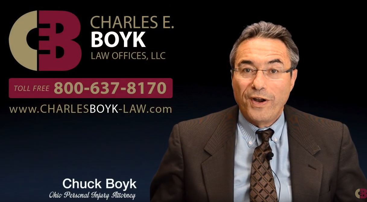 banner with the portrait of Charles BOyk, the firm logo and phone number