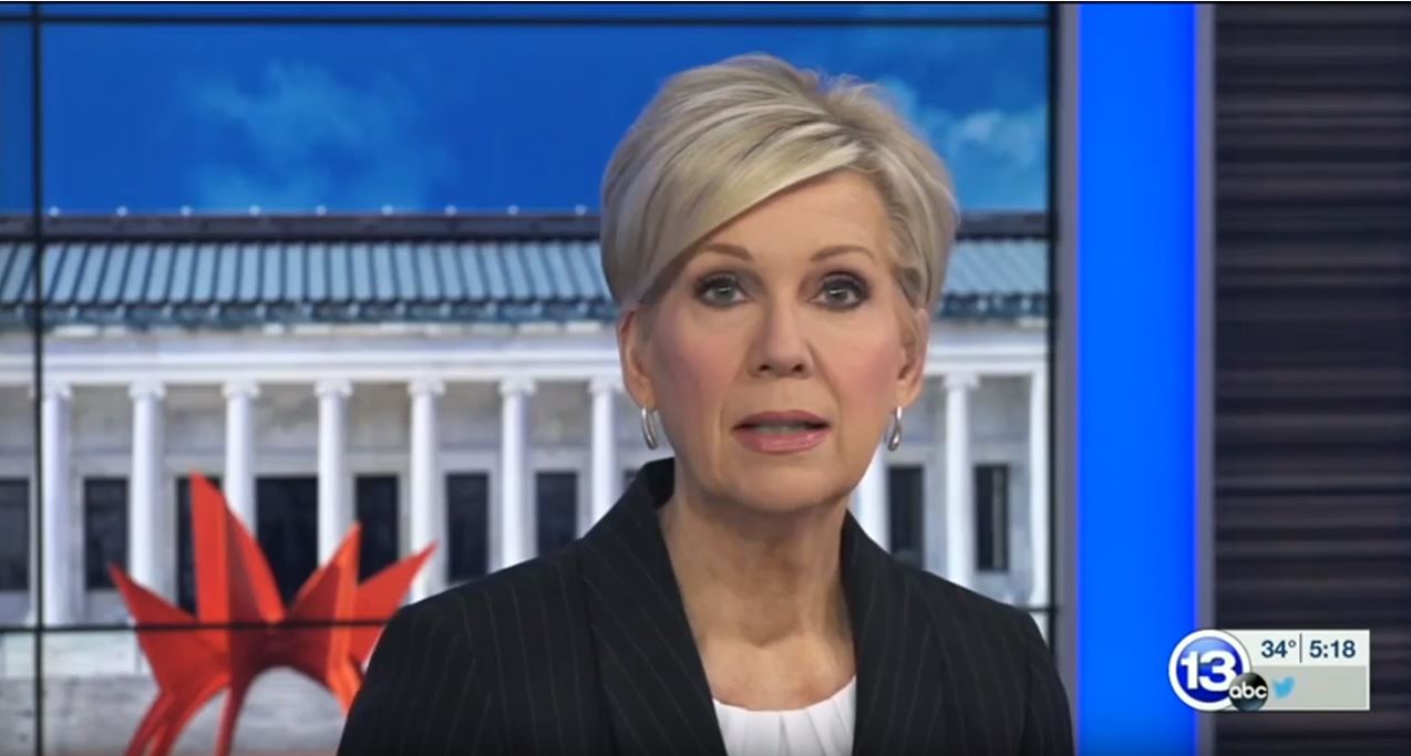 screenshot of a tv program at ABC with the portrait of a middle aged blonde woman speaking